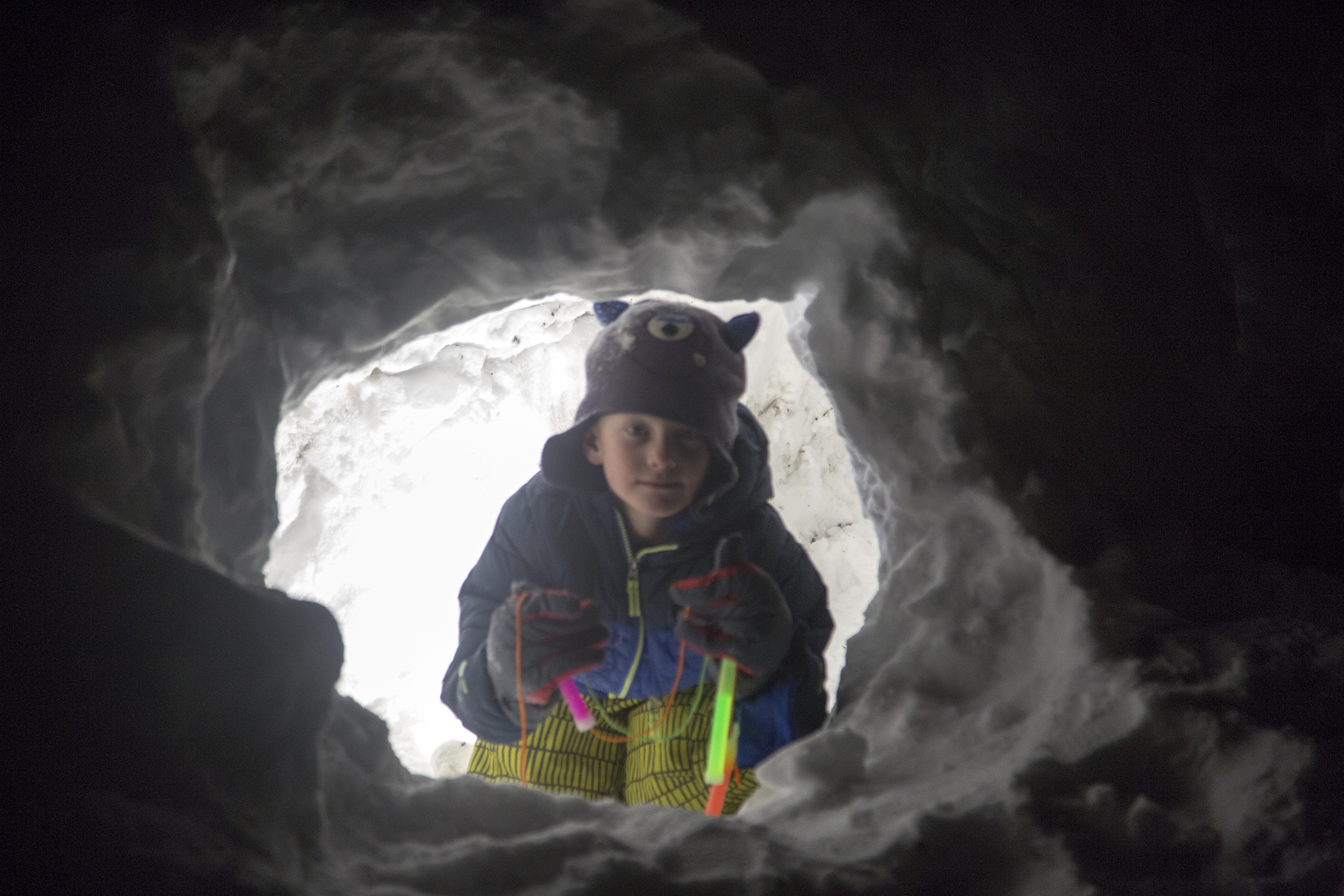 playing in a snow cave with glow sticks