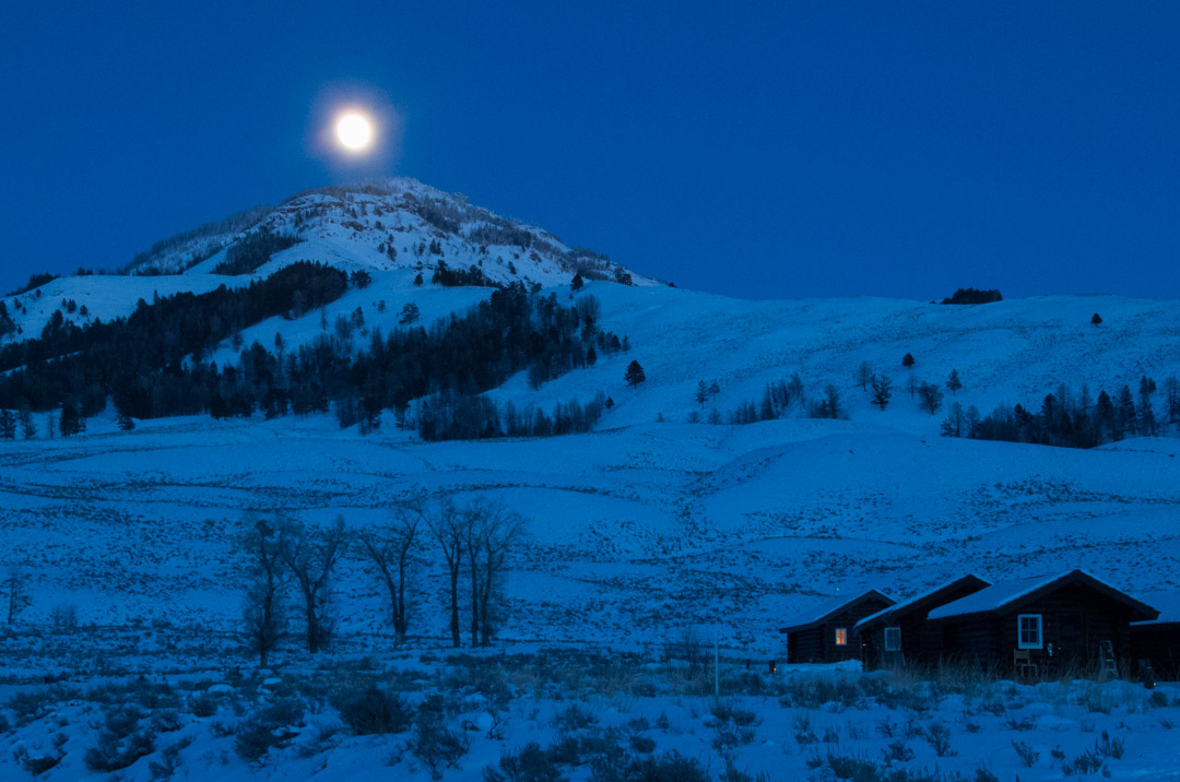 A Wolf Moon rises over the Lamar Valley Buffalo Ranch on New Year's Eve in Yellowstone National Park