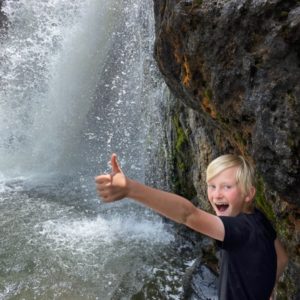 Yellowstone Resource Library kid and waterfall